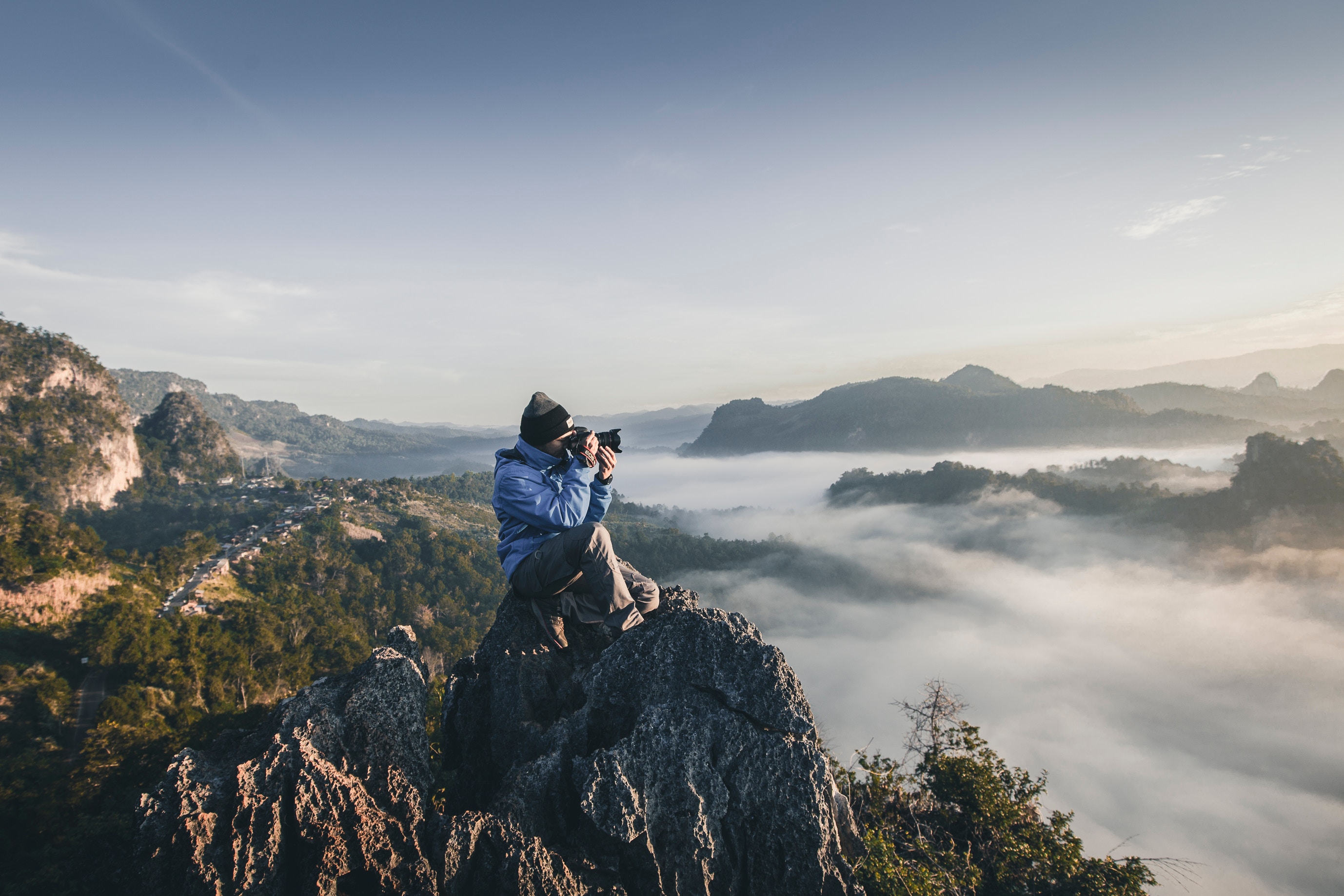 Man taking a picture on a mountain